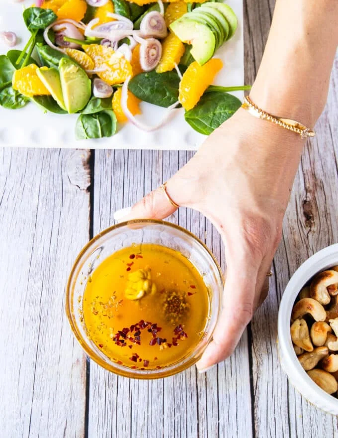 Orange dressing ingredients in a bowl