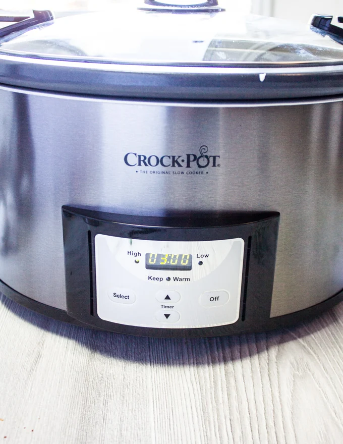 setting up the crock pot for three hours on high to start the roasting process