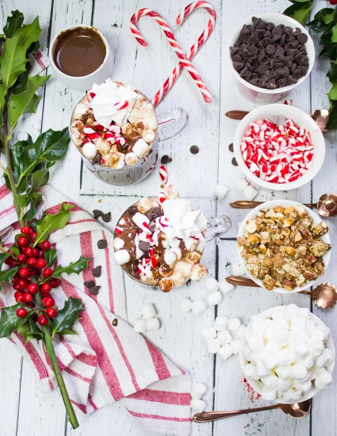 Top view of hot chocolate bar toppings and the perfect homemade hot chocolate cups