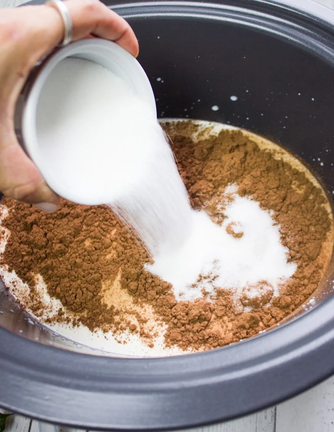 adding sugar to the crockpot mixture