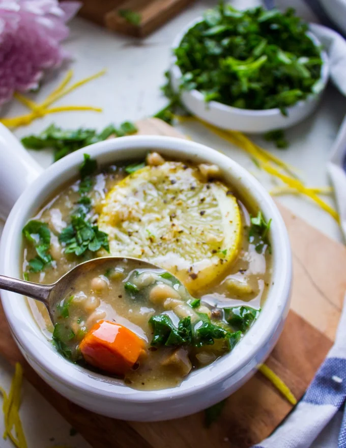A spoon eating soup showing the veggies