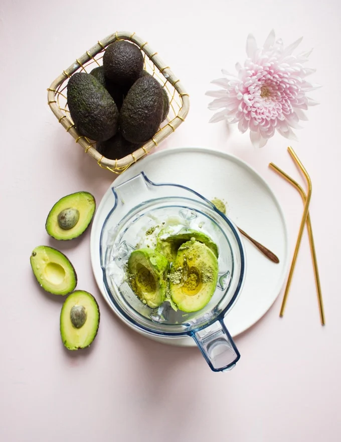 All the avocado smoothie recipe ingredients are placed in a blender