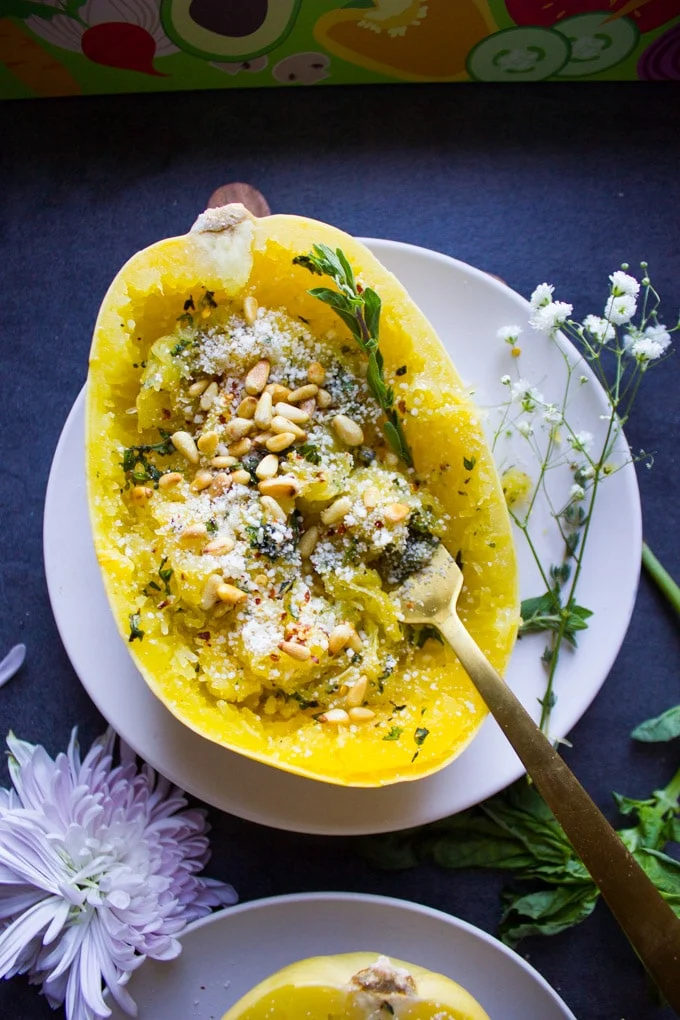 One fork twisting inside the spaghetti squash to show gather the strands of spaghetti squash recipe