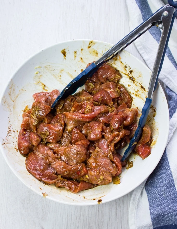 A bowl with the lamb marinating