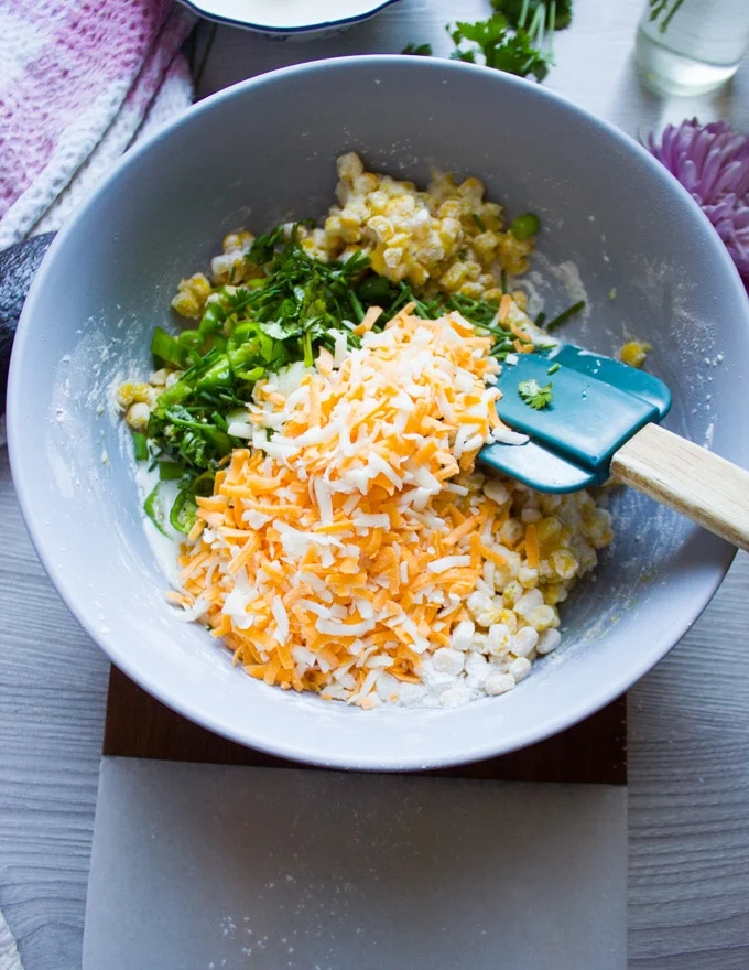 Cheese, jalapenos and herbs going in to the bater