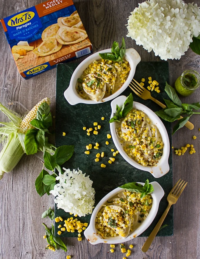 Out of the oven corn casseole made with pierogies and served with fresh basil