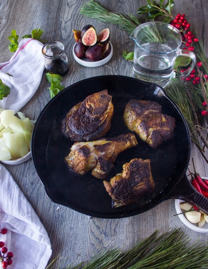 seared lamb meat on a skillet ready for the sauec