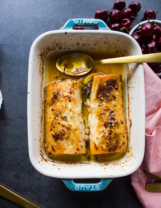 Baked mahi mahi right out of the oven with melted butter around it ready to serve
