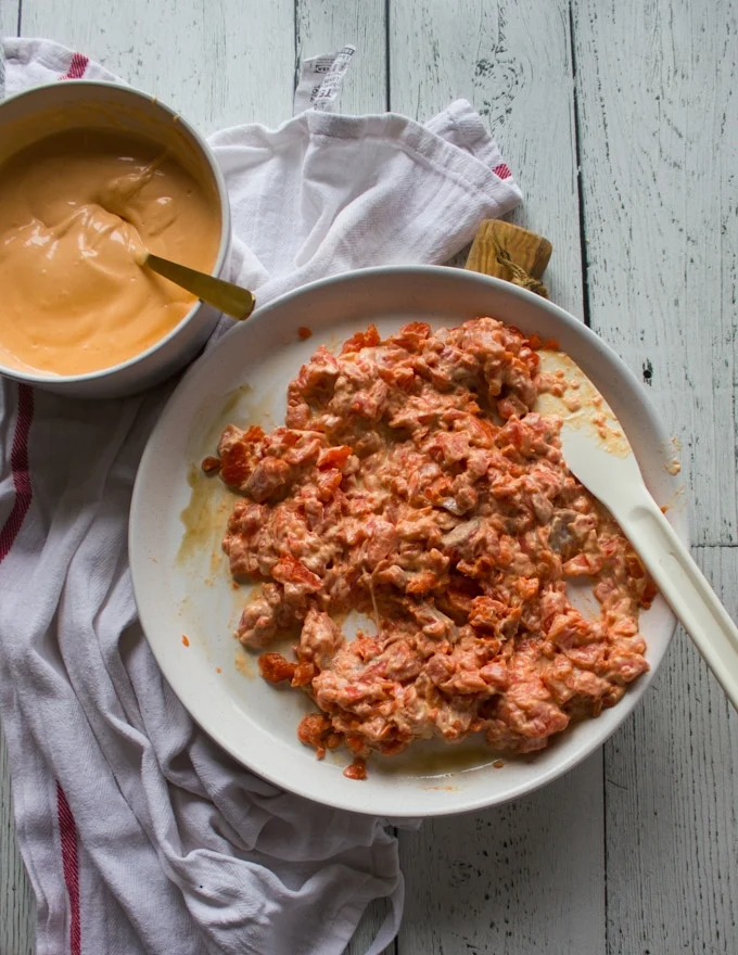 Spicy Salmon sushi mixture ready on a plate for the sushi burrito