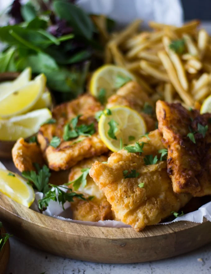 A pile of fish fry and lemon slices