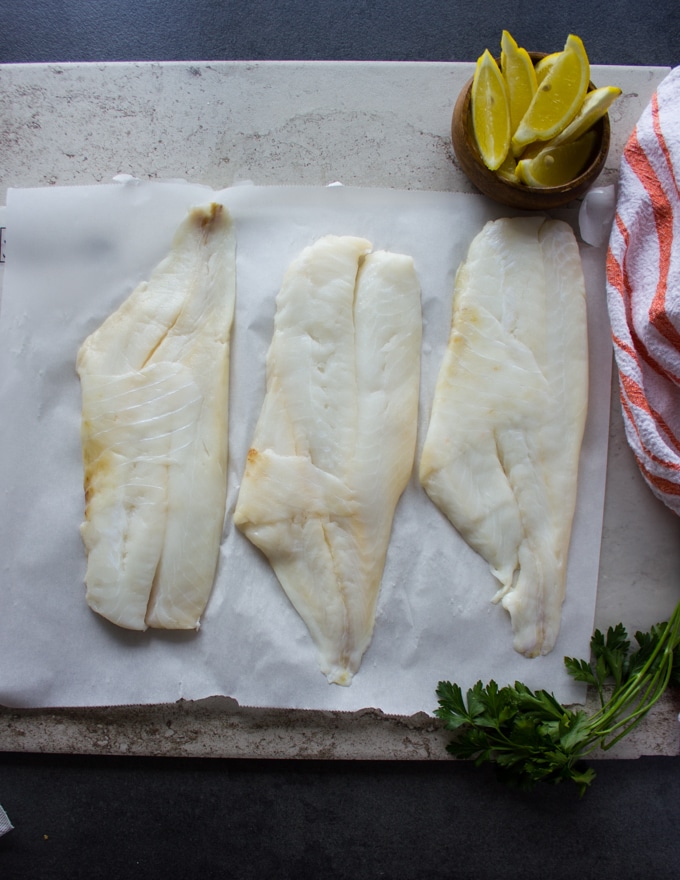 Orange roughy fillets on a white marble