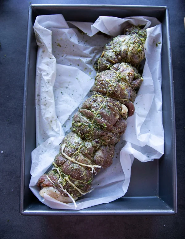 stuffed and ready boneless leg of lamb going in the oven