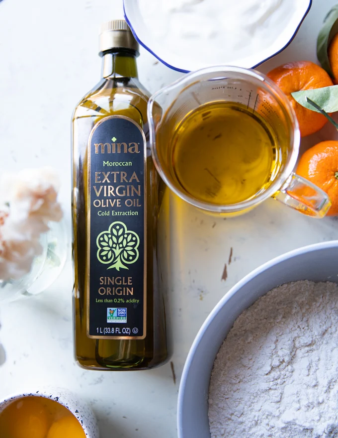 A cup pf pure extra virgin olive oil in a glass cup showing the clarity and purity of the oil