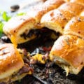 Close up of one Philly Cheesesteak sandwich showing the filling and cheese