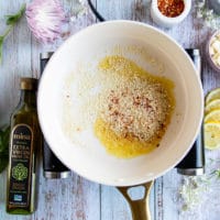 bread crumbs in a skillet with some olive ready to toast