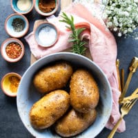 seasoned Russet potatoes drizzled with oil and ready for the air fryer