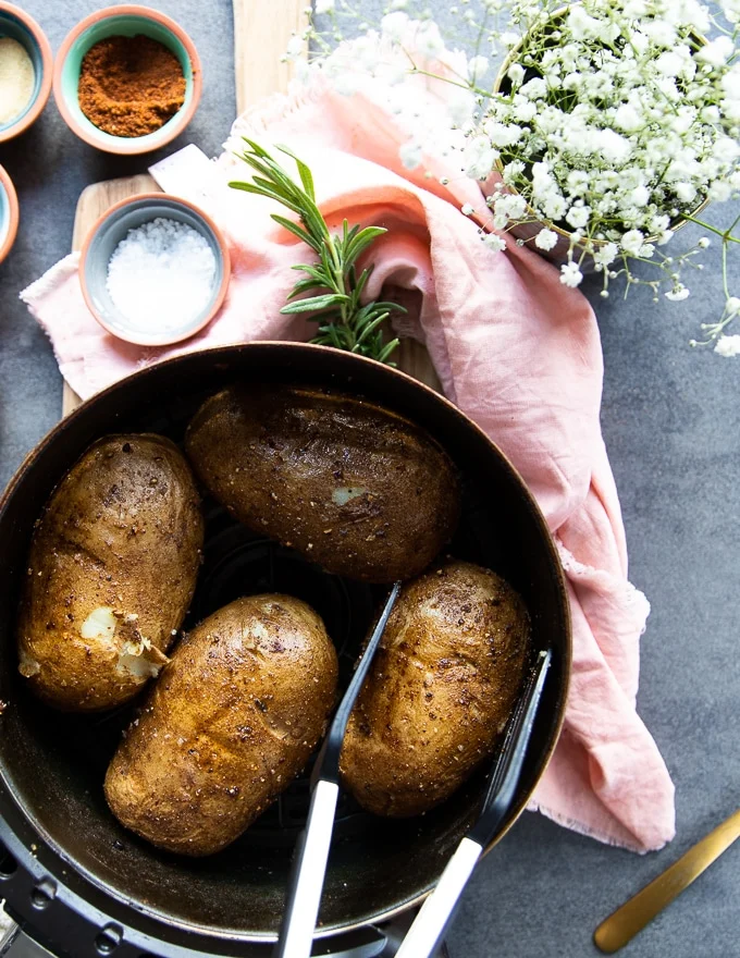 perfectly cooked air fried potatoes in the air fryer basket. Crispy and ready.