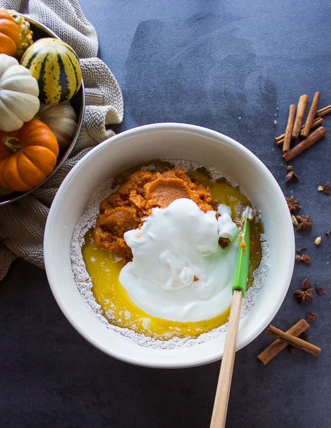 the wet ingredients added into one bowl to make the pumpkin donuts recipe