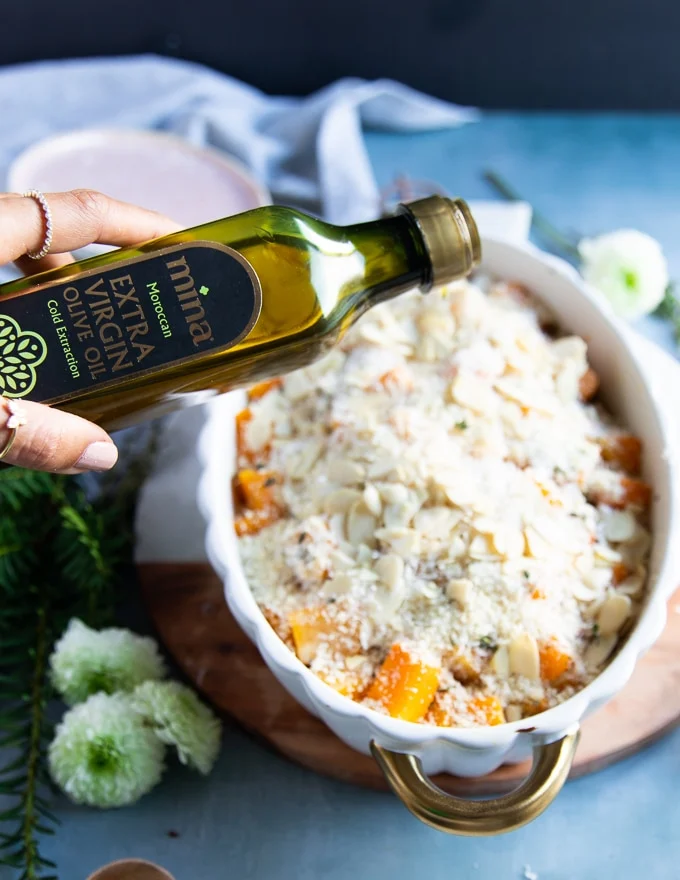 A final drizzle of olive oil over the casserole before it goes back into the oven