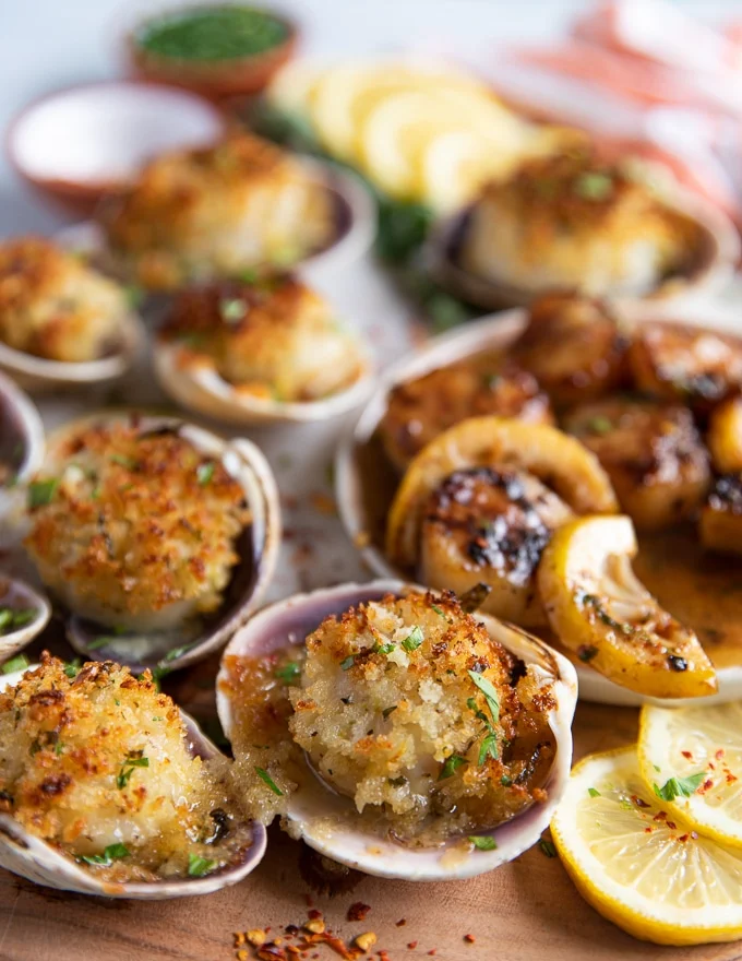 close up of baked scallops in their shells cooked out of the oven and golden
