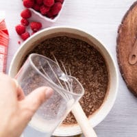 Adding milk or vegan milk to chocolate pudding recipe
