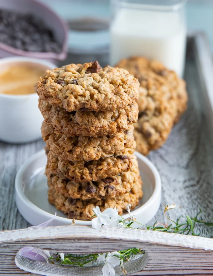 A stack of oatmeal cookies on a white plate close up
