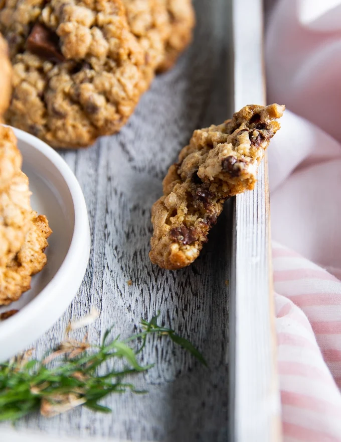 a piece of oatmeal cookie over a tray cut in half