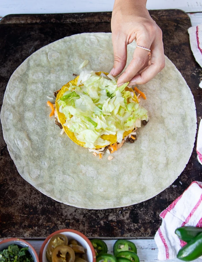 shredded lettuce layered over the sour cream layer