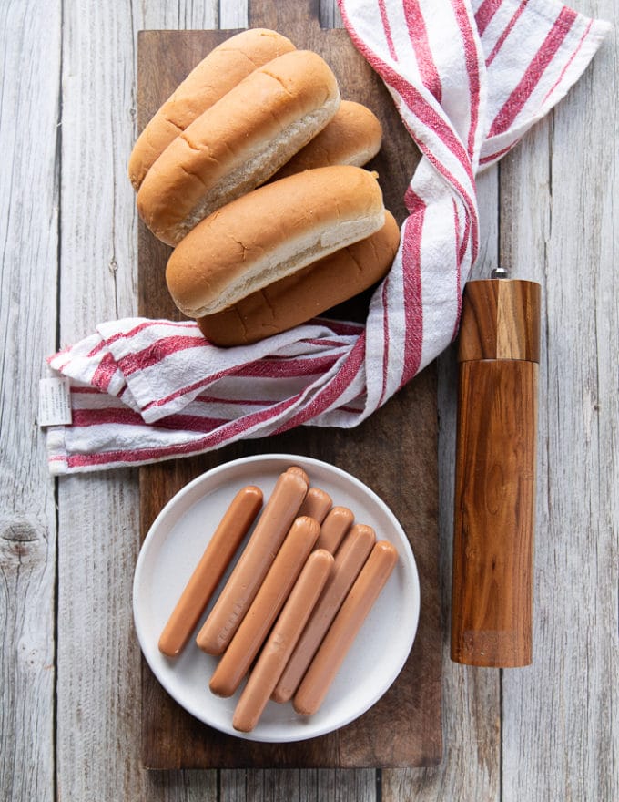 Ingredients for Air fryer hot dogs on a board all gathered and ready