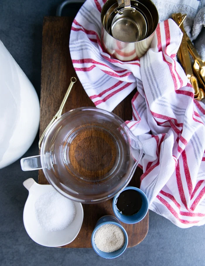 Ingredients for pizza dough: honey, olive oil, flour, salt, yeast