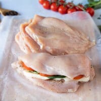The other half of the chicken is folded over the filling