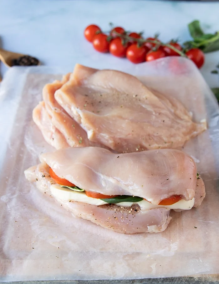The other half of the chicken is folded over the filling