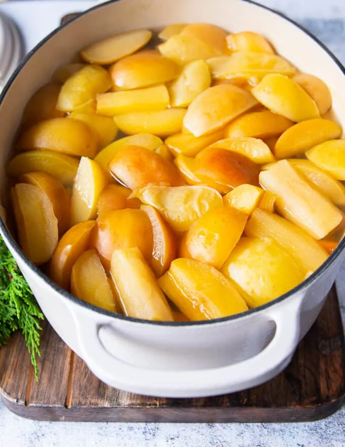 Apples cooked and softened in the large 7 quart pot after 2 hours of simmering