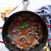 All stew ingredients added into the pot and ready to cook over low heat