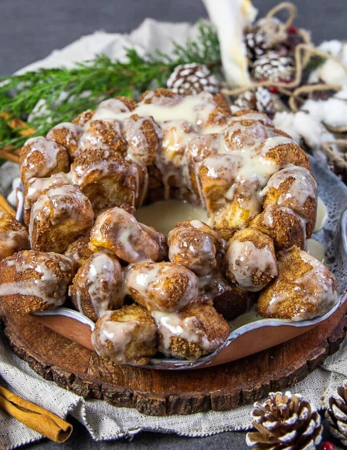 A final plate of cinnamon roll monkey bread with glaze on a plate