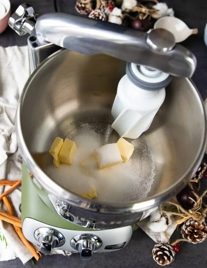 the butter and sugar are being creamed first in a stand mixer