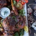 close up of one roast leg of lamb out of the oven golden brown and perfectly cooked