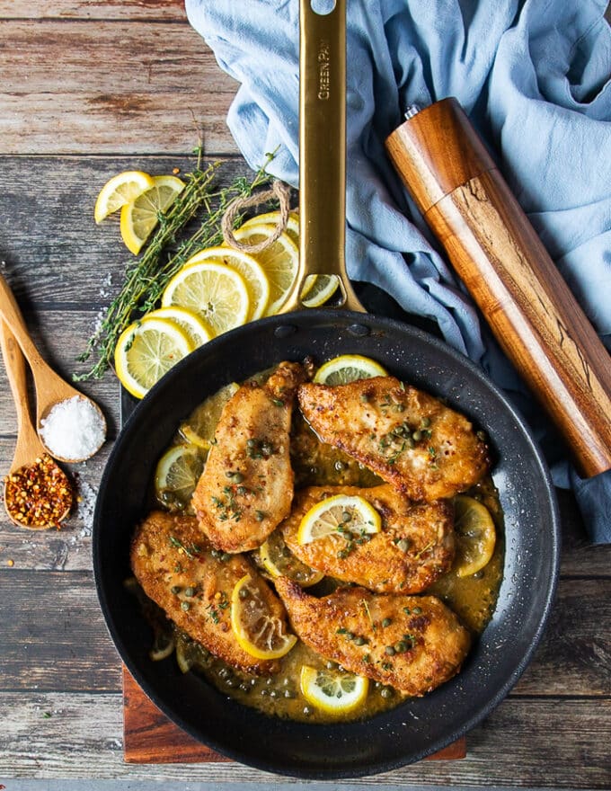 The chicken added back to the skillet with the sauce to make chicken scallopini