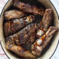 lamb shanks added back to the pan and ready to be braised with the sauce