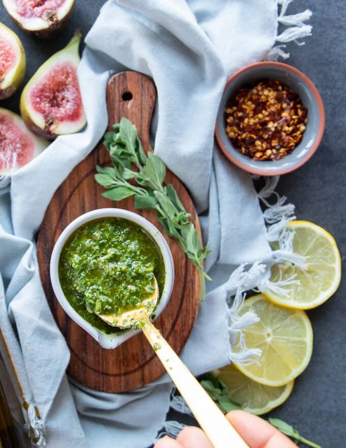 A spoon showing the texture and consistency of a delicious chermoula recipe