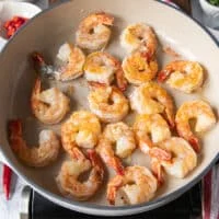 golden shrimp cooked in the pan and flipped over