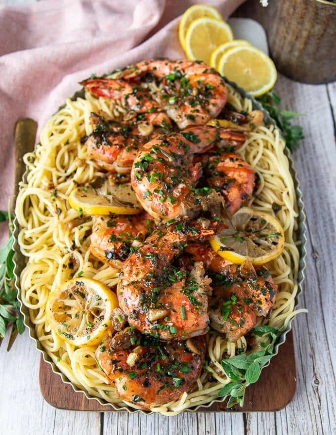 Final plated dish of shrimp scampi over pasta ready to serve