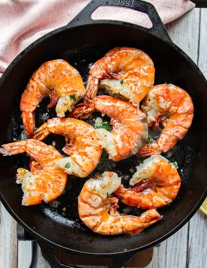 All shrimp in the pan flipped and cooked on both sides