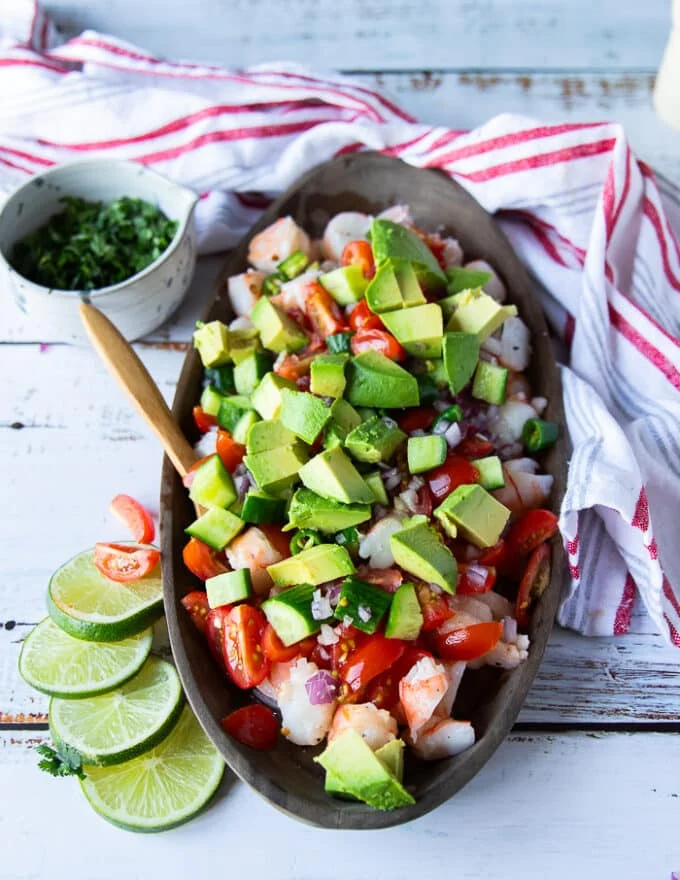 The remaining ingredients are added over the shrimp in the platter