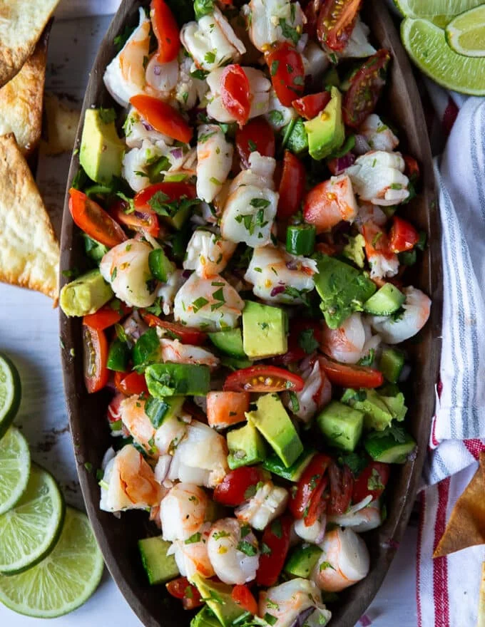 close up of a half a plate of shrimp ceviche recipe showing the colors and texture of the dish