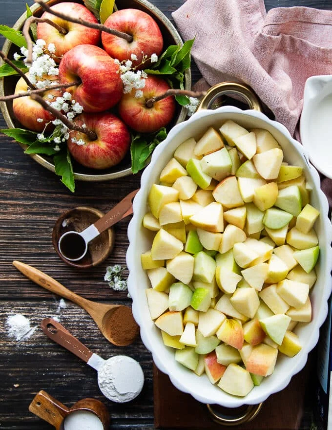 The apples diced up and added in the baking dish to make the crumble