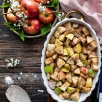 The apple mixture ready and tossed with cinnamon, sugar and flour in the baking dish ready for the topping