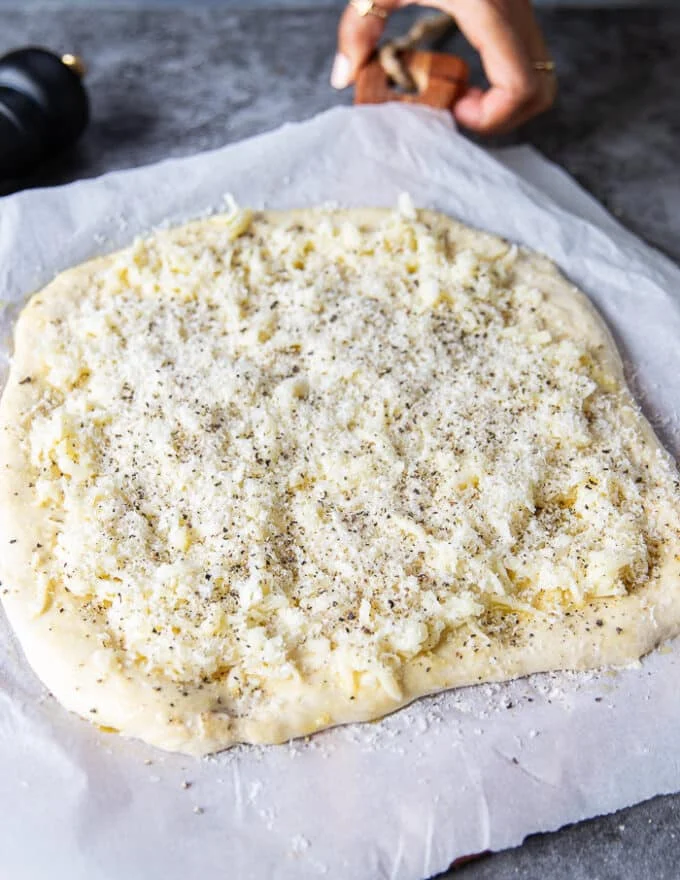 Cacio e pepe pizza ready to go in the oven