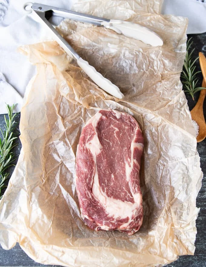 One piece of ribeye steak showing the perfectly marbled meat and how fresh it is