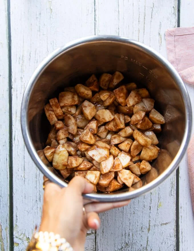 All apple butter ingredients added to the bowl of the instant pot
